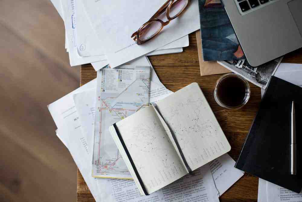 an open notebook sitting on top of a wooden table