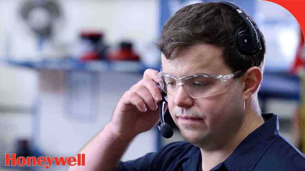 a man wearing headphones while talking on a cell phone