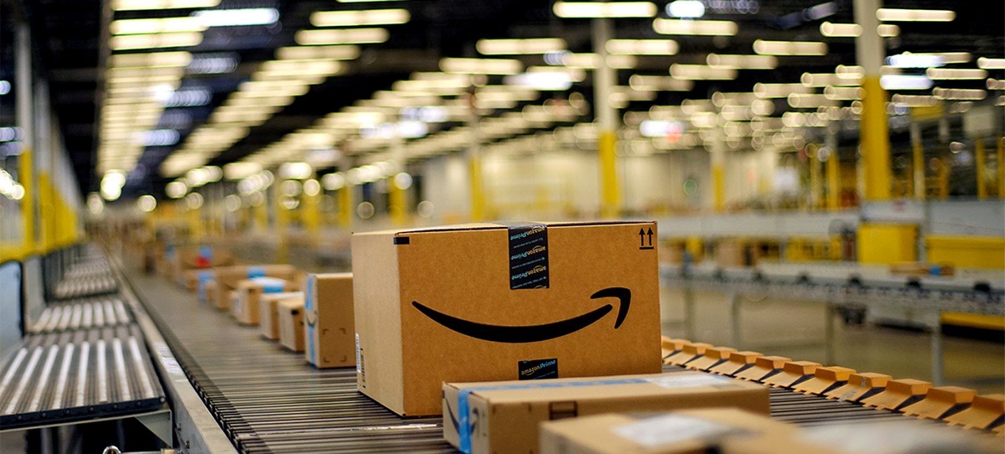 an amazon box sitting on top of a conveyor belt