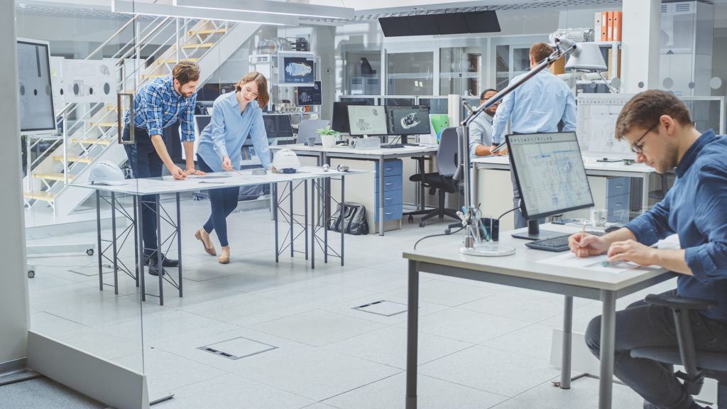 a group of people in a lab working on computers