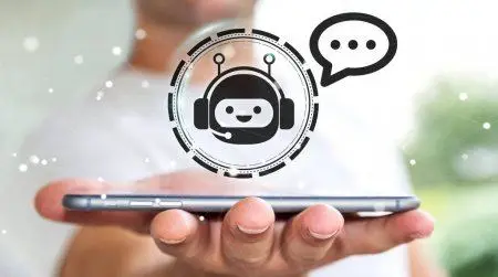 a person holding a cell phone with a speech bubble above it
