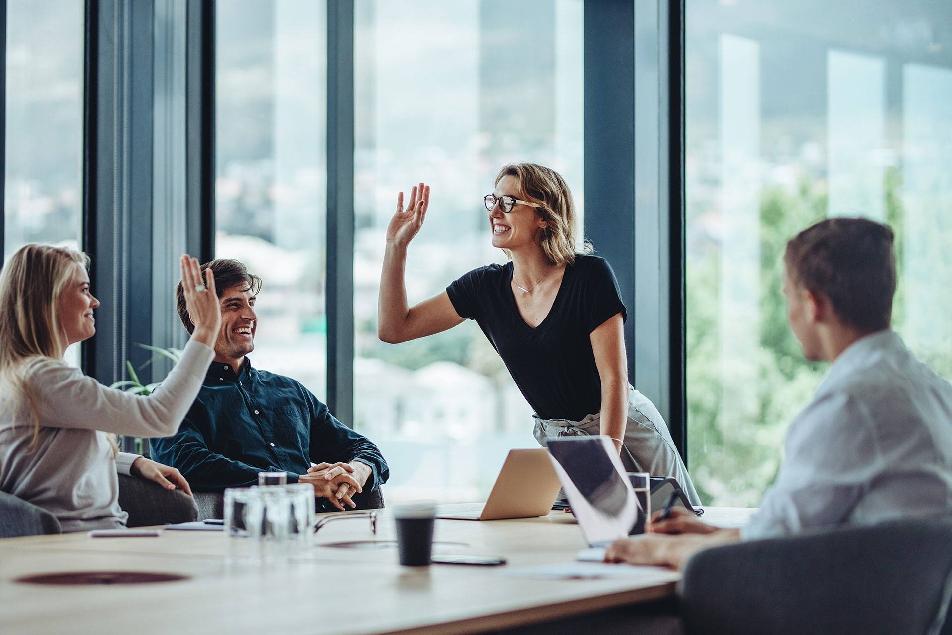 a group of people sitting around a conference table