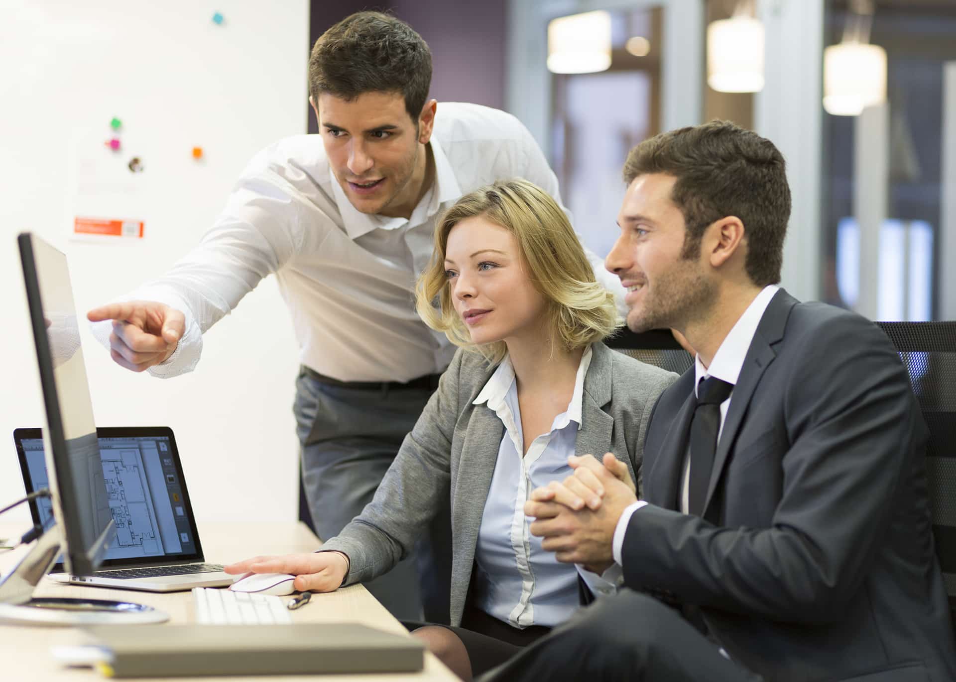 two business people looking at a computer screen