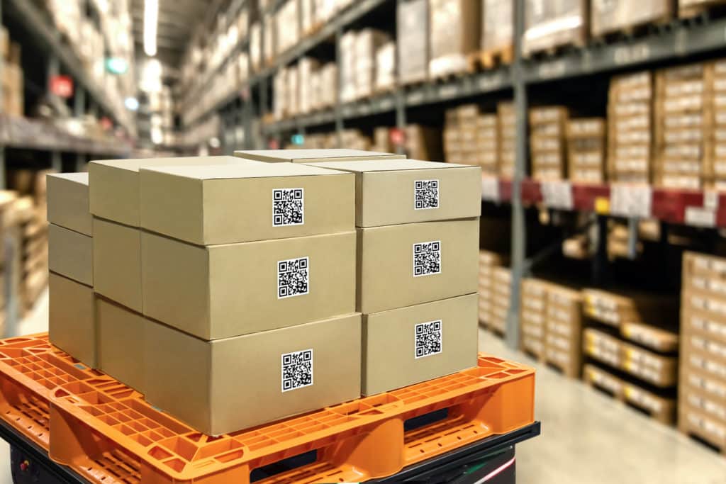 boxes are stacked on top of each other in a warehouse