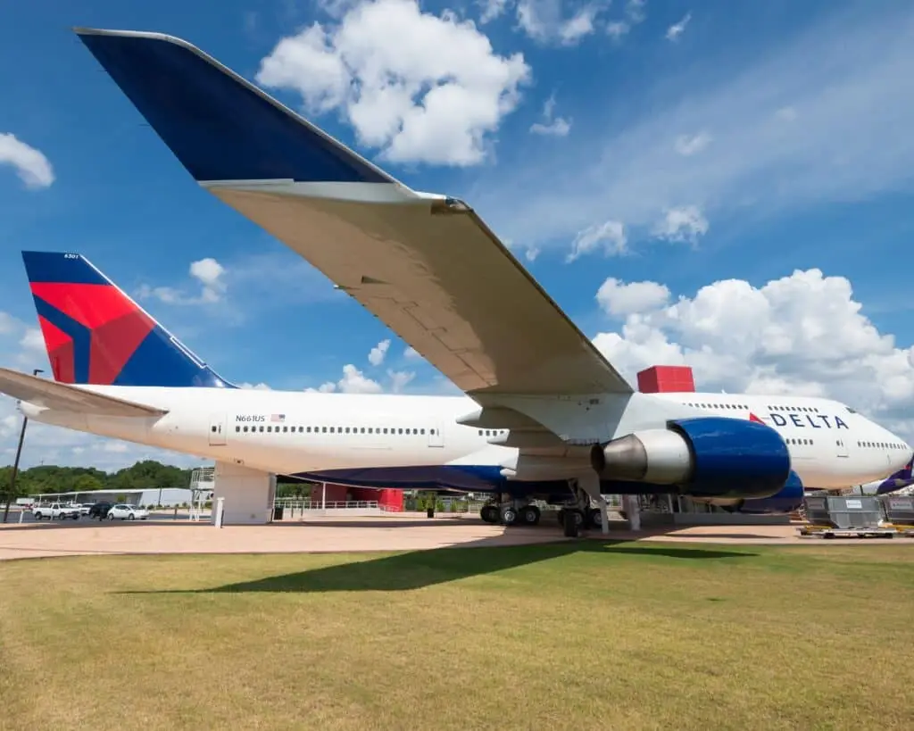 the tail end of an airplane on a runway