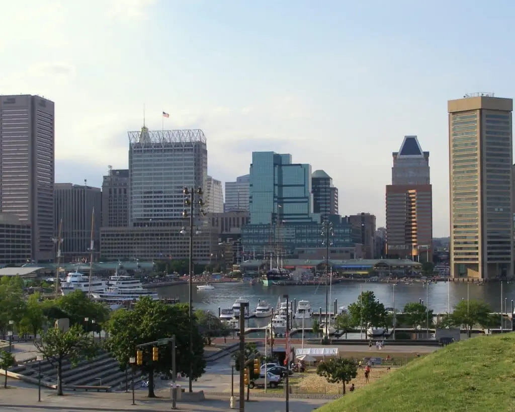 a city skyline with boats in the water