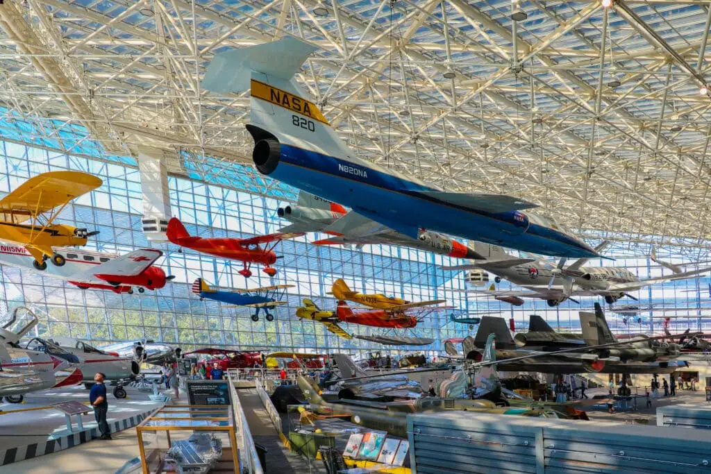 a bunch of planes that are hanging from the ceiling