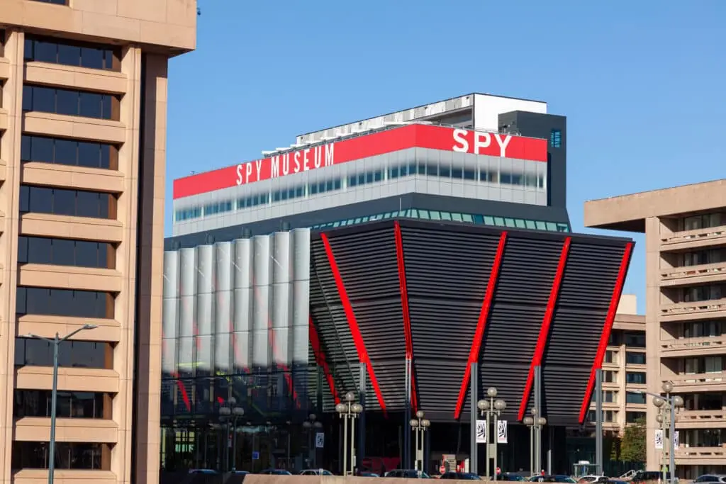 a large building with a red and white sign on top