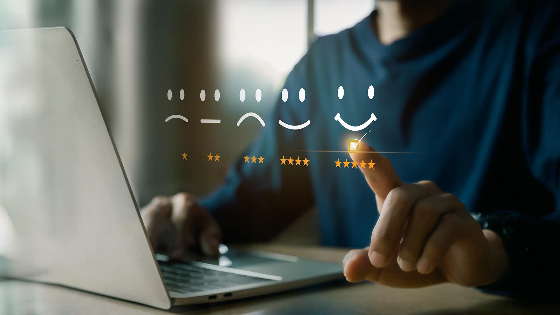 a person sitting in front of a laptop computer