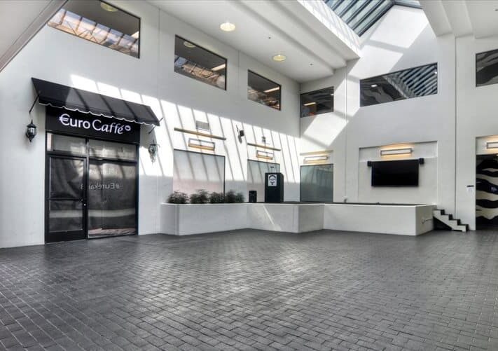 an empty building with a skylight in the middle